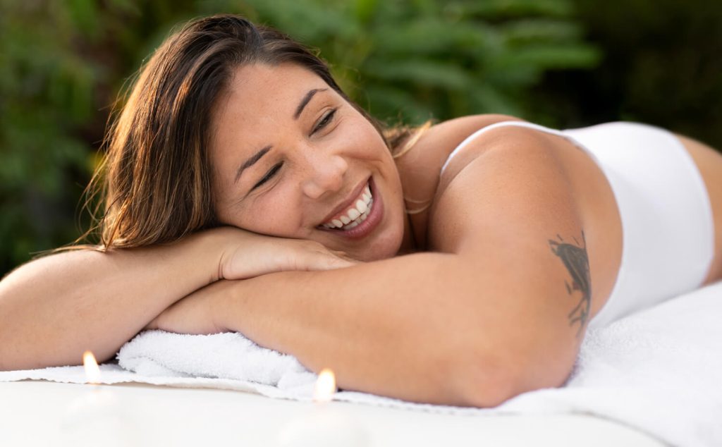 Happy woman receiving a massage