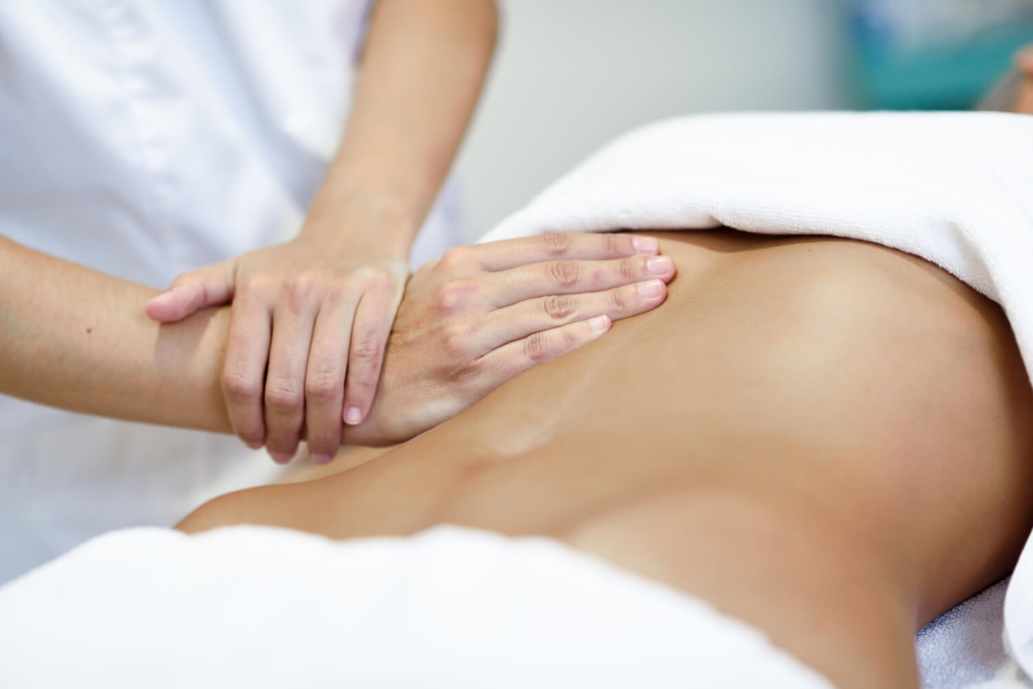 Manual lymphatic drainage massage on abdomen to relieve Cyprus summer bloating and water retention in Nicosia